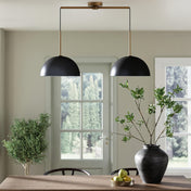 Suspension luminaire en coque noir Glowe Studio au style moderne et design