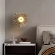 Applique murale LED dorée en verre style soleil — vue 1