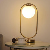 Lampe à poser design LED avec anneau en métal et boule en verre